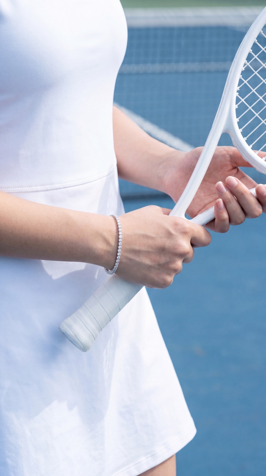 Wrist and racquet on court