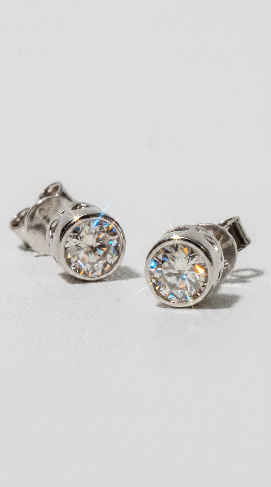 Bezel stud earrings macro