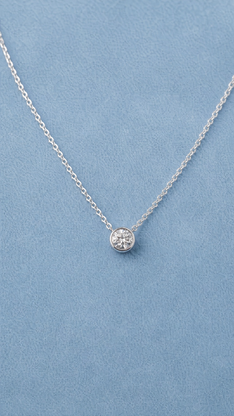 Necklace on blue suede